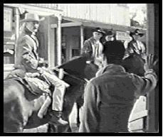 The posse rides off leaving Johnny to guard Laramie