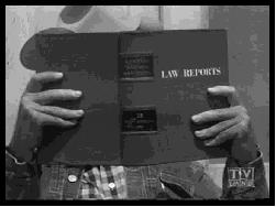 Apprentice lawyer Tom Brewster reading a lawbook