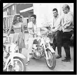 Ann-Margret and Peter Brown on motor bikes