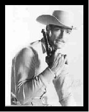 John Russell as Dan Troop revolver in hand