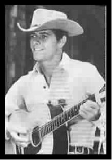 Peter Brown playing guitar or at least posed with one