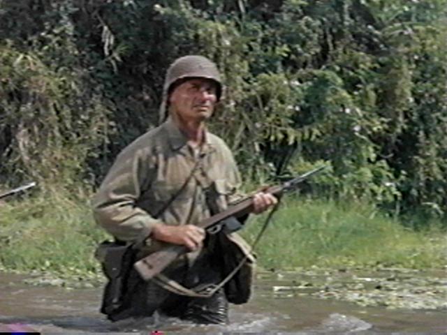 General Merrill leads the main force across a river