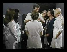 Female office workers appearing to give Jerry rapt attention