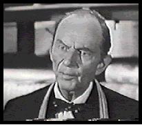 Earle Hodgins as Pane the storekeeper
