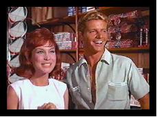 Augie (Barbara Eden] and Chase [Peter Brown] buy New Years fireworks
