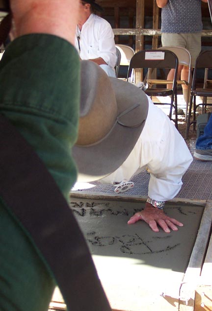 Peter does a pushup in the cement