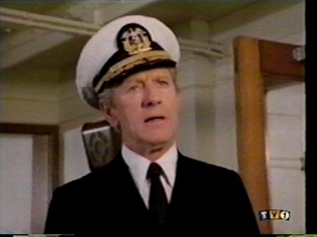 John Anderson as the Captain